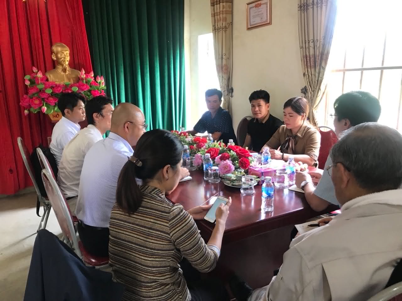 Partners and stakeholders seated together at a formal meeting